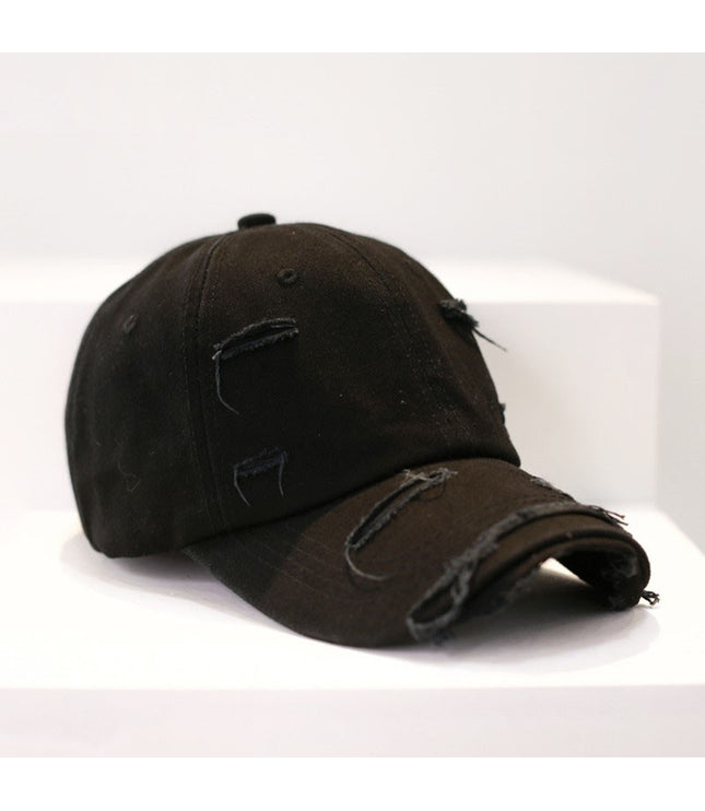 Zerrissene Cap